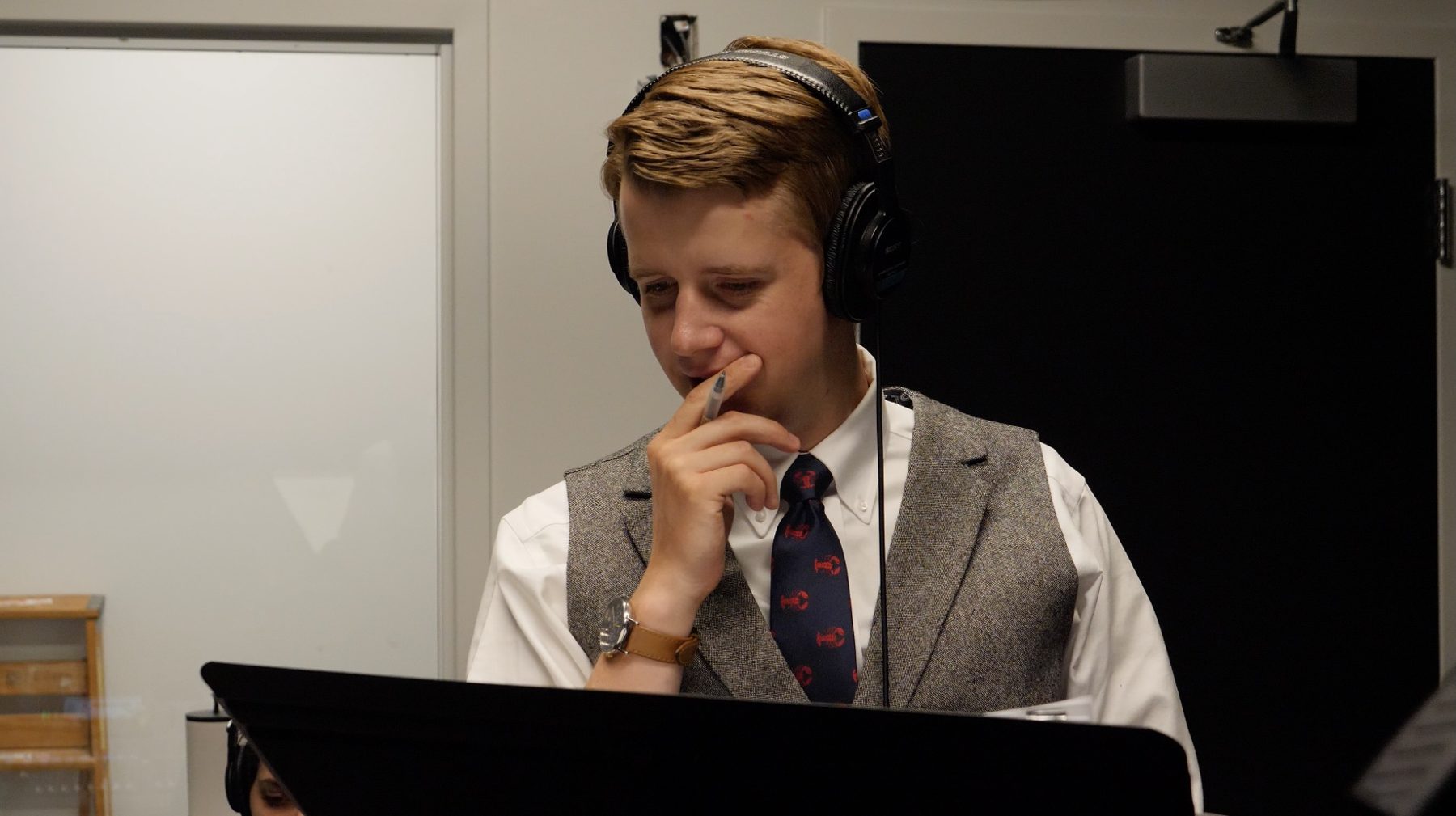 Peter directing, wearing headphones